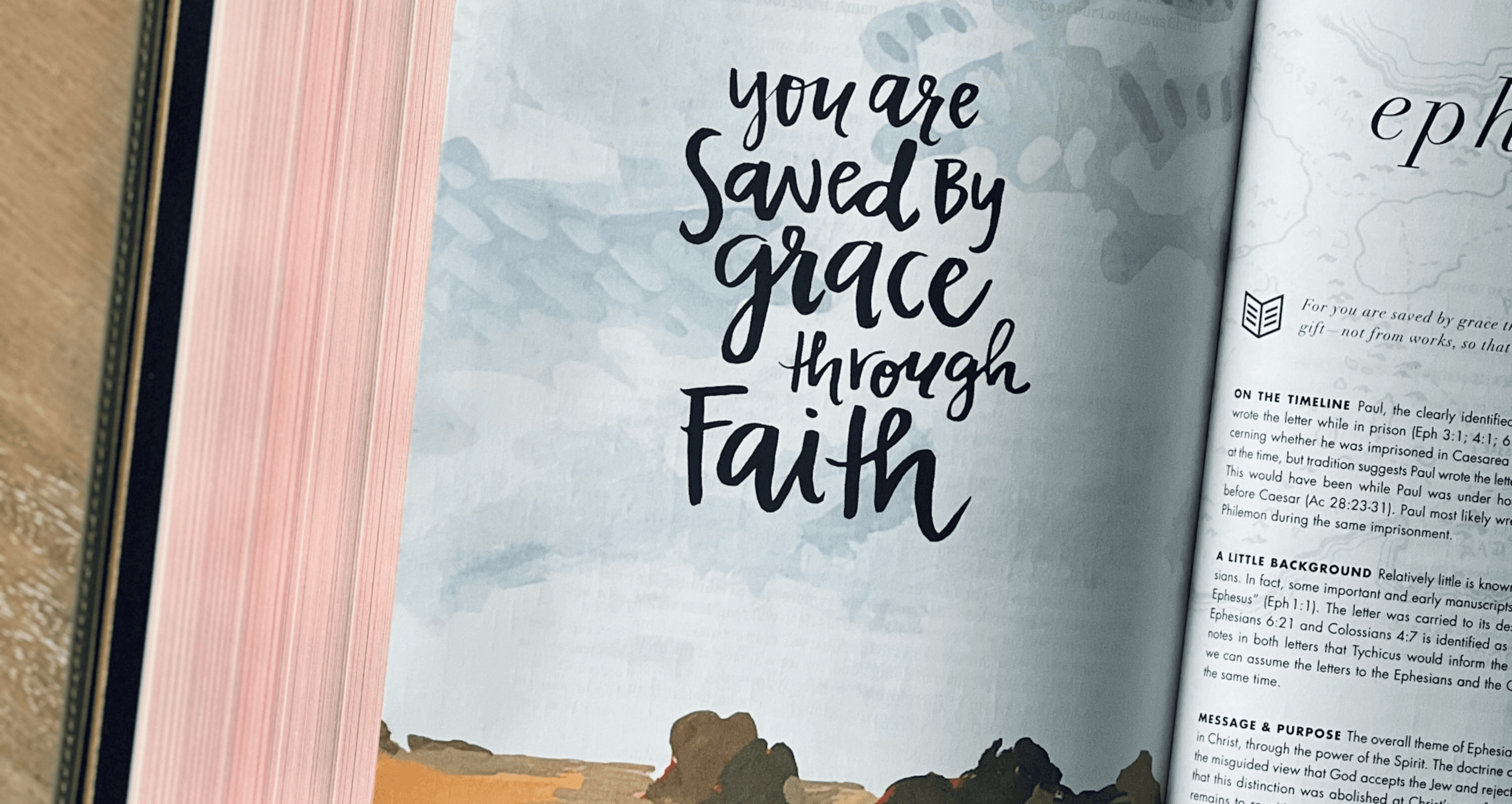 An open Bible with the words ‘you are saved by grace through faith’